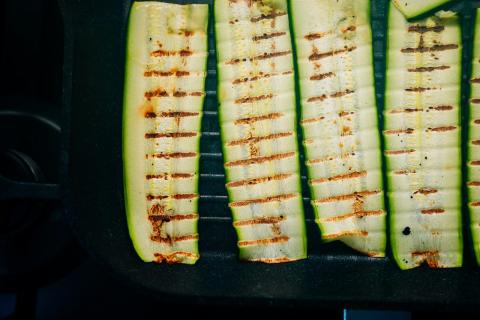 Grilled zucchini slices in a pan - indicative photo for the Vegetarian Dishes group