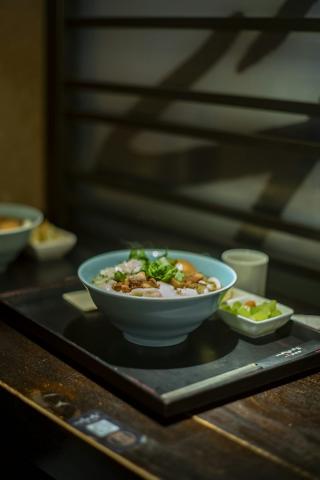 A bowl of noodles with toppings and a side dish - indicative photo for the Stir Fried Noodles group