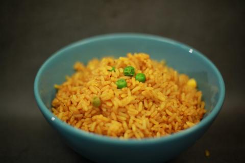A bowl of fried rice with peas - indicative photo for the Rice Dishes group